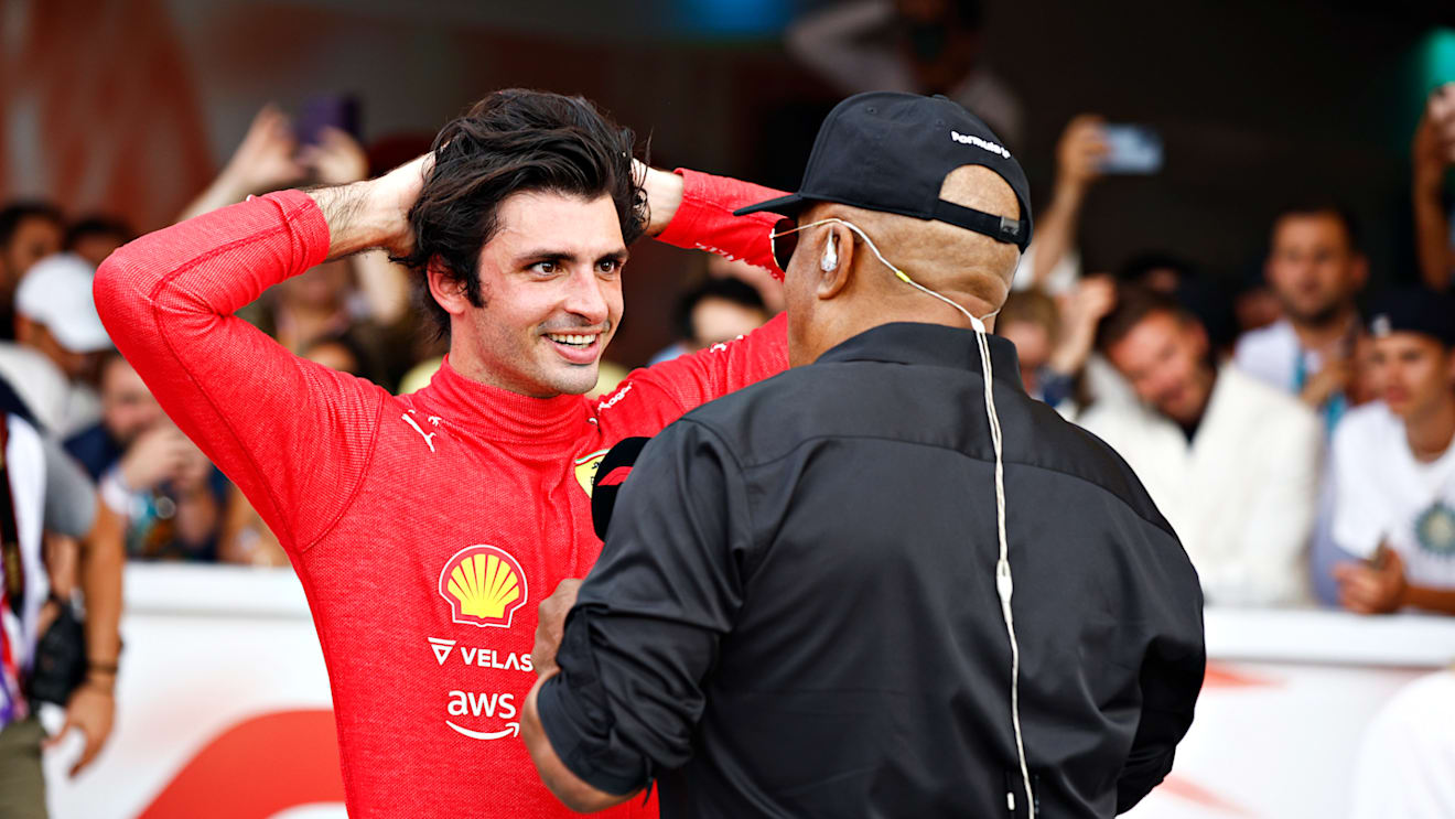 MIAMI, FLORIDA - MAY 08: Third placed Carlos Sainz of Spain and Ferrari talks with Willy T Ribbs in parc ferme during the F1 Grand Prix of Miami at the Miami International Autodrome on May 08, 2022 in Miami, Florida. (Photo by Jared C. Tilton/Getty Images)
