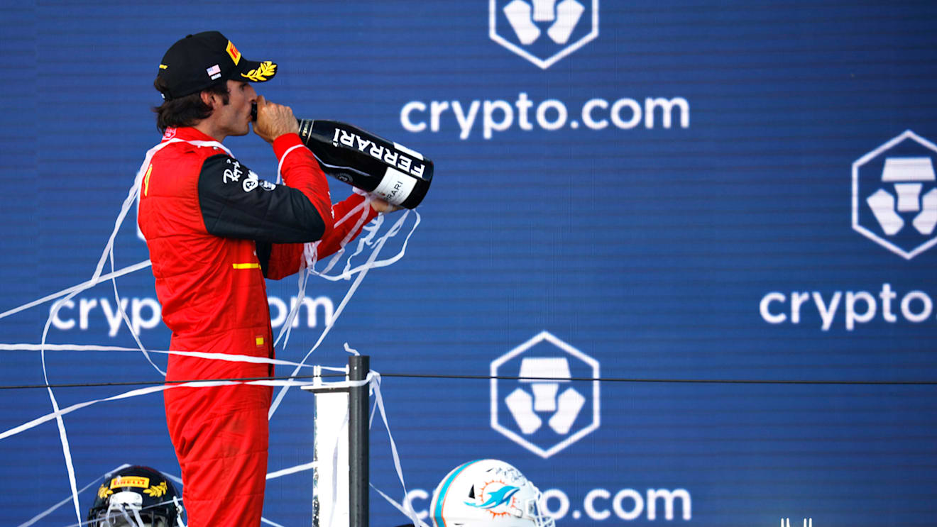 MIAMI, FLORIDA - MAY 08: Third placed Carlos Sainz of Spain and Ferrari celebrates on the podium during the F1 Grand Prix of Miami at the Miami International Autodrome on May 08, 2022 in Miami, Florida. (Photo by Chris Graythen/Getty Images)
