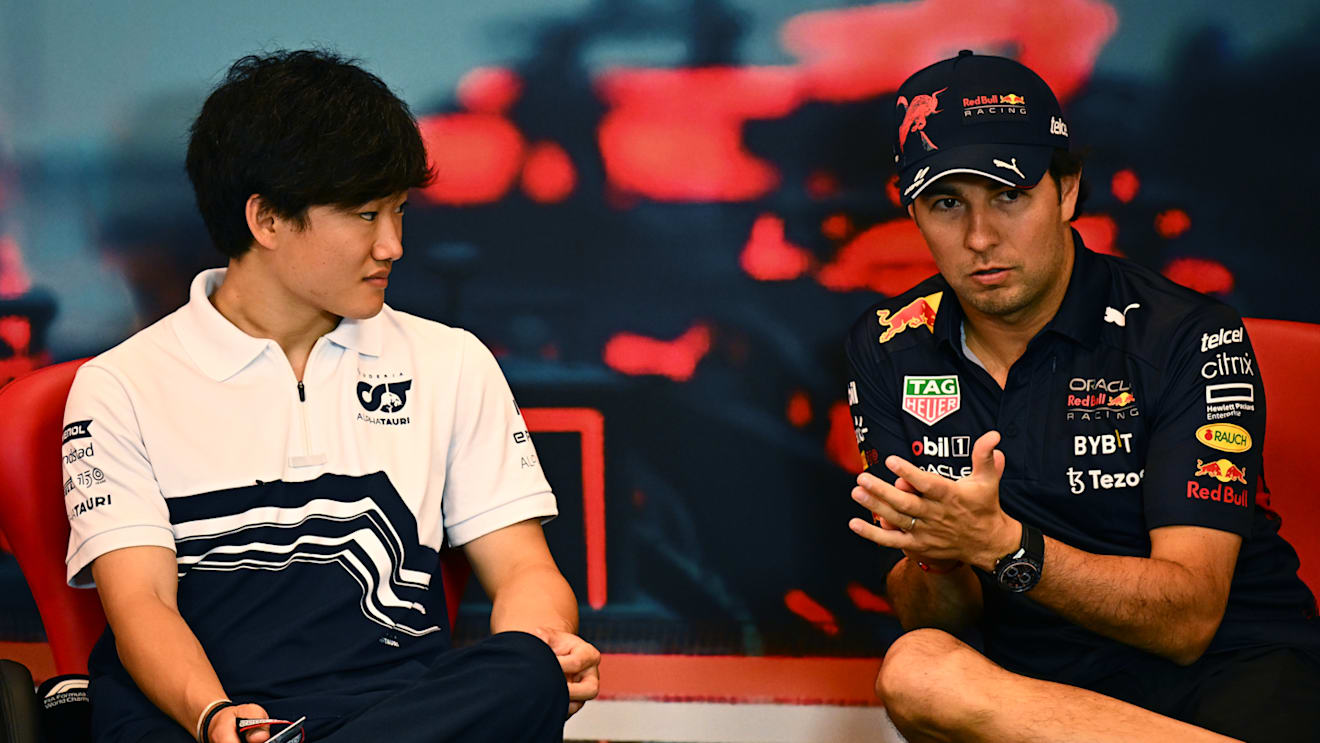MONTE-CARLO, MONACO - MAY 27: Yuki Tsunoda of Japan and Scuderia AlphaTauri and Sergio Perez of Mexico and Oracle Red Bull Racing talk in the Drivers Press Conference prior to practice ahead of the F1 Grand Prix of Monaco at Circuit de Monaco on May 27, 2022 in Monte-Carlo, Monaco. (Photo by Clive Mason/Getty Images)