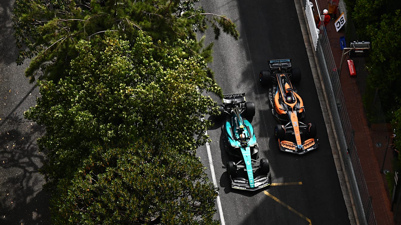 MONTE-CARLO, MONACO - MAY 29: Sebastian Vettel of Germany driving the (5) Aston Martin AMR22 Mercedes and Daniel Ricciardo of Australia driving the (3) McLaren MCL36 Mercedes battle for track position during the F1 Grand Prix of Monaco at Circuit de Monaco on May 29, 2022 in Monte-Carlo, Monaco. (Photo by Clive Mason - Formula 1/Formula 1 via Getty Images)