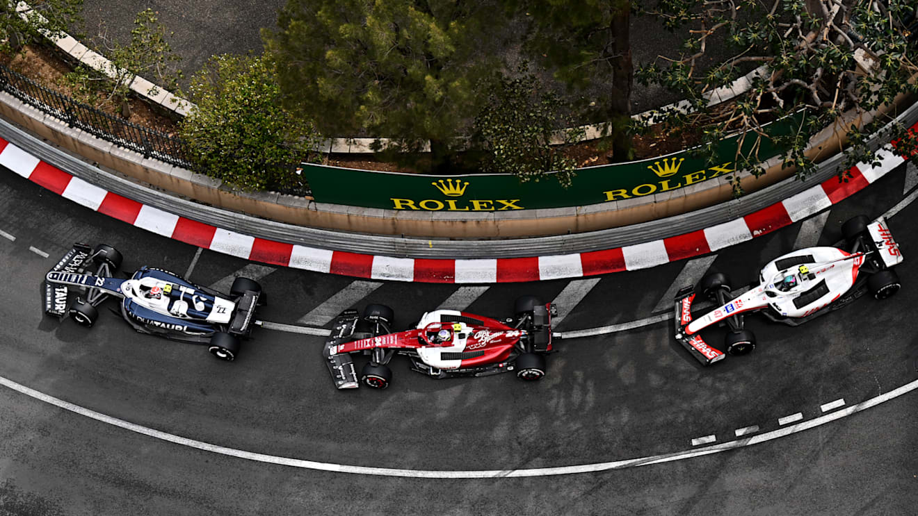 MONTE-CARLO, MONACO - MAY 29: Yuki Tsunoda of Japan driving the (22) Scuderia AlphaTauri AT03 leads Zhou Guanyu of China driving the (24) Alfa Romeo F1 C42 Ferrari and Mick Schumacher of Germany driving the (47) Haas F1 VF-22 Ferrari during the F1 Grand Prix of Monaco at Circuit de Monaco on May 29, 2022 in Monte-Carlo, Monaco. (Photo by Clive Mason - Formula 1/Formula 1 via Getty Images)