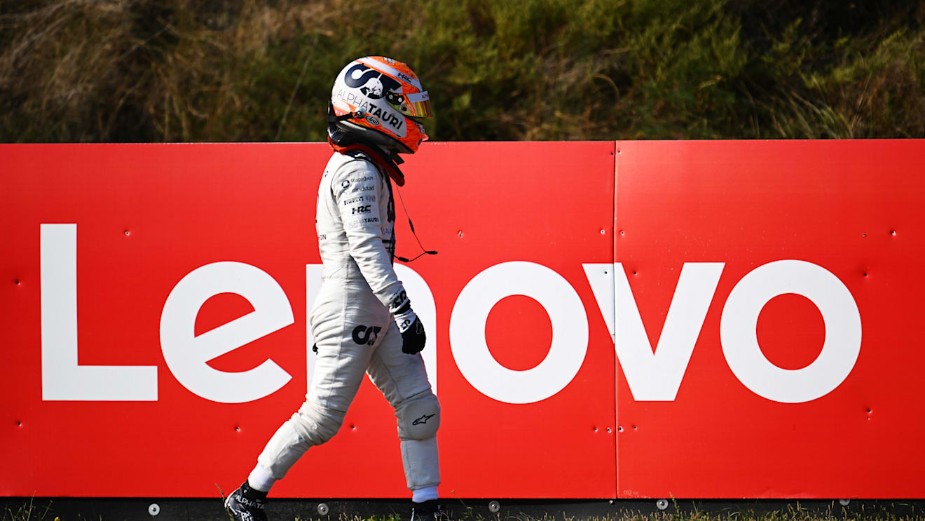 ZANDVOORT, NETHERLANDS - SEPTEMBER 02: Yuki Tsunoda of Japan and Scuderia AlphaTauri walks back to the pitlane after stopping on track during practice ahead of the F1 Grand Prix of The Netherlands at Circuit Zandvoort on September 02, 2022 in Zandvoort, Netherlands. (Photo by Clive Mason/Getty Images)