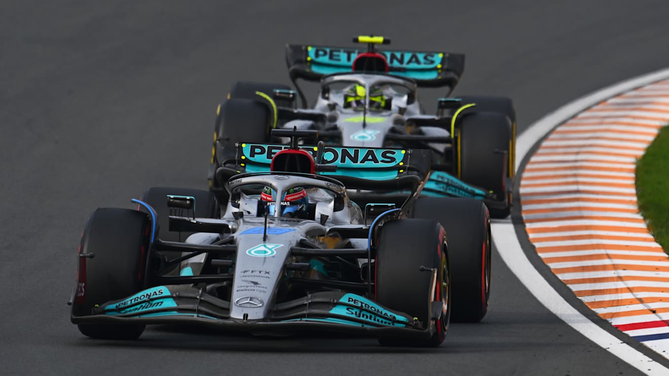 ZANDVOORT, NETHERLANDS - SEPTEMBER 04: George Russell of Great Britain driving the (63) Mercedes AMG Petronas F1 Team W13 leads Lewis Hamilton of Great Britain driving the (44) Mercedes AMG Petronas F1 Team W13 during the F1 Grand Prix of The Netherlands at Circuit Zandvoort on September 04, 2022 in Zandvoort, Netherlands. (Photo by Clive Mason/Getty Images)