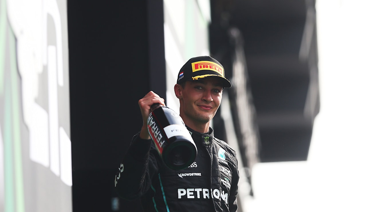 ZANDVOORT, NETHERLANDS - SEPTEMBER 04: Second placed George Russell of Great Britain and Mercedes celebrates on the podium during the F1 Grand Prix of The Netherlands at Circuit Zandvoort on September 04, 2022 in Zandvoort, Netherlands. (Photo by Lars Baron - Formula 1/Formula 1 via Getty Images)