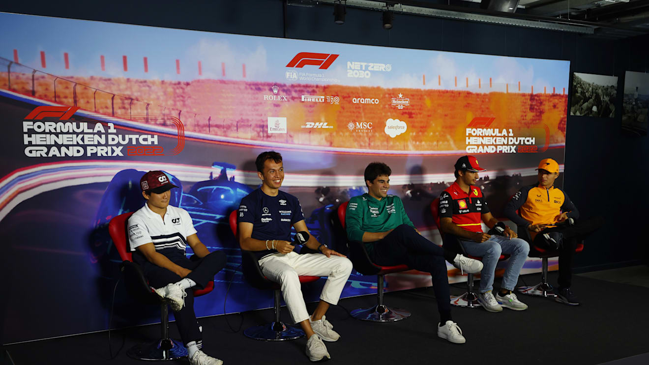ZANDVOORT, NETHERLANDS - SEPTEMBER 01: (L-R) Yuki Tsunoda of Japan and Scuderia AlphaTauri, Alexander Albon of Thailand and Williams, Lance Stroll of Canada and Aston Martin F1 Team, Carlos Sainz of Spain and Ferrari and Lando Norris of Great Britain and McLaren attend the Drivers Press Conference during previews ahead of the F1 Grand Prix of The Netherlands at Circuit Zandvoort on September 01, 2022 in Zandvoort, Netherlands. (Photo by Lars Baron/Getty Images)