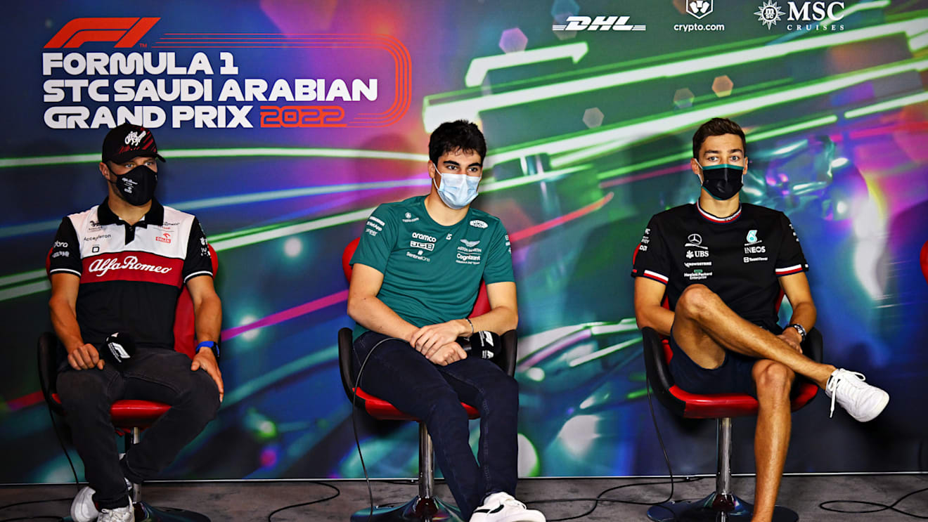 JEDDAH, SAUDI ARABIA - MARCH 25: (L-R) Valtteri Bottas of Finland and Alfa Romeo F1, Lance Stroll of Canada and Aston Martin F1 Team and George Russell of Great Britain and Mercedes attend the Drivers Press Conference before practice ahead of the F1 Grand Prix of Saudi Arabia at the Jeddah Corniche Circuit on March 25, 2022 in Jeddah, Saudi Arabia. (Photo by Clive Mason/Getty Images)