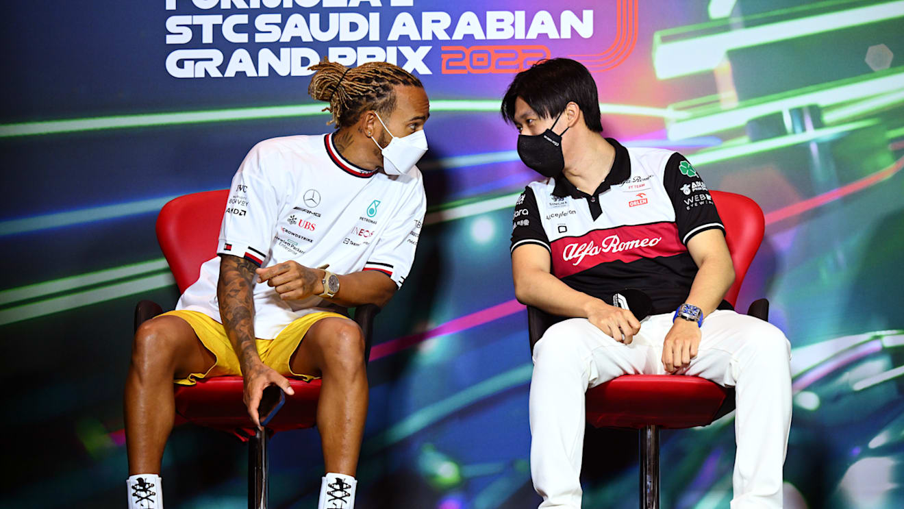 JEDDAH, SAUDI ARABIA - MARCH 25: Lewis Hamilton of Great Britain and Mercedes and Zhou Guanyu of China and Alfa Romeo F1 talk in the Drivers Press Conference before practice ahead of the F1 Grand Prix of Saudi Arabia at the Jeddah Corniche Circuit on March 25, 2022 in Jeddah, Saudi Arabia. (Photo by Clive Mason/Getty Images)
