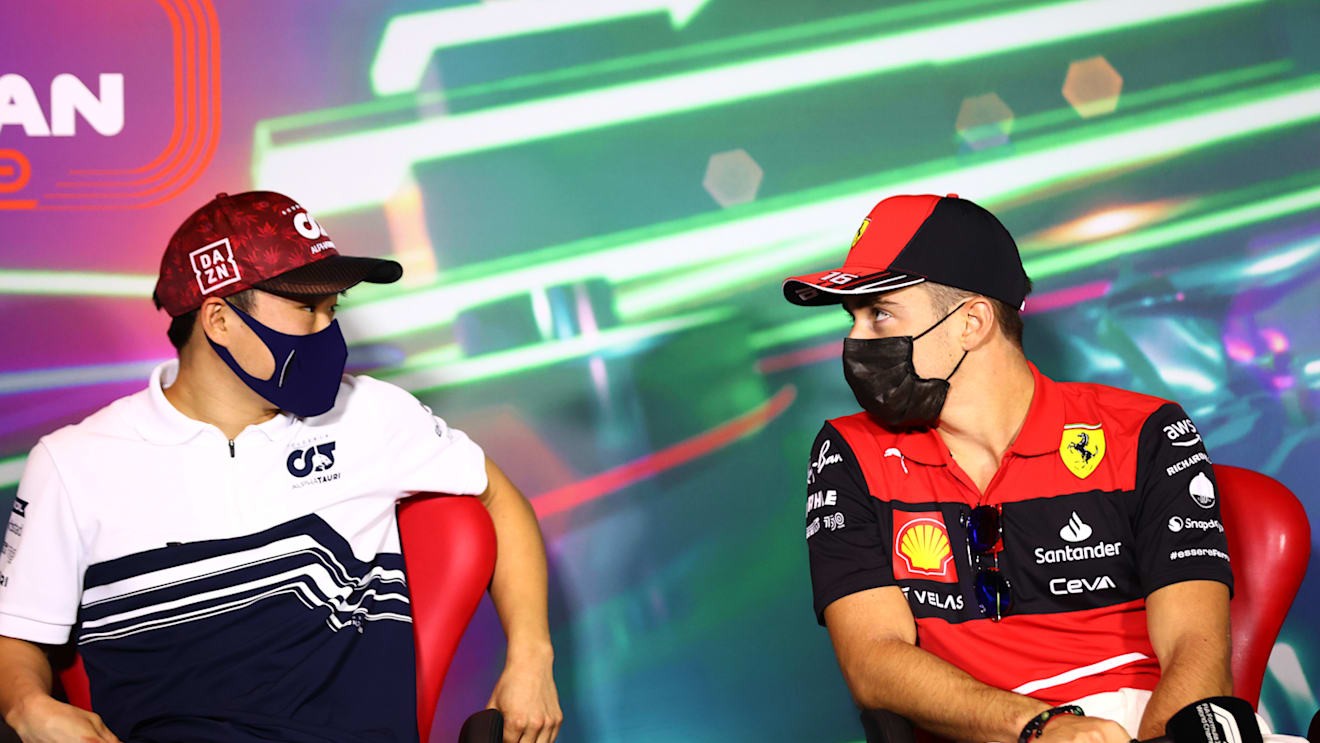 JEDDAH, SAUDI ARABIA - MARCH 25: Yuki Tsunoda of Japan and Scuderia AlphaTauri and Charles Leclerc of Monaco and Ferrari talk in the Drivers Press Conference before practice ahead of the F1 Grand Prix of Saudi Arabia at the Jeddah Corniche Circuit on March 25, 2022 in Jeddah, Saudi Arabia. (Photo by Dan Istitene - Formula 1/Formula 1 via Getty Images)