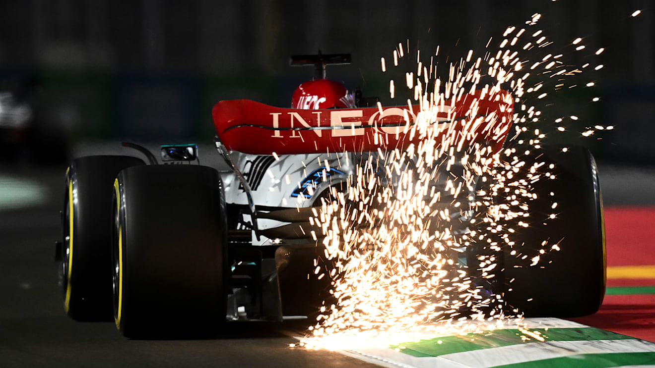 JEDDAH, SAUDI ARABIA - MARCH 25: Sparks fly behind George Russell of Great Britain driving the (63) Mercedes AMG Petronas F1 Team W13 on track during practice ahead of the F1 Grand Prix of Saudi Arabia at the Jeddah Corniche Circuit on March 25, 2022 in Jeddah, Saudi Arabia. (Photo by Clive Mason/Getty Images)