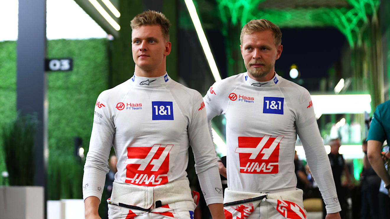 JEDDAH, SAUDI ARABIA - MARCH 25:  Mick Schumacher of Germany and Haas F1 and Kevin Magnussen of Denmark and Haas F1 walk in the paddock after practice ahead of the F1 Grand Prix of Saudi Arabia at the Jeddah Corniche Circuit on March 25, 2022 in Jeddah, Saudi Arabia. (Photo by Dan Istitene - Formula 1/Formula 1 via Getty Images)