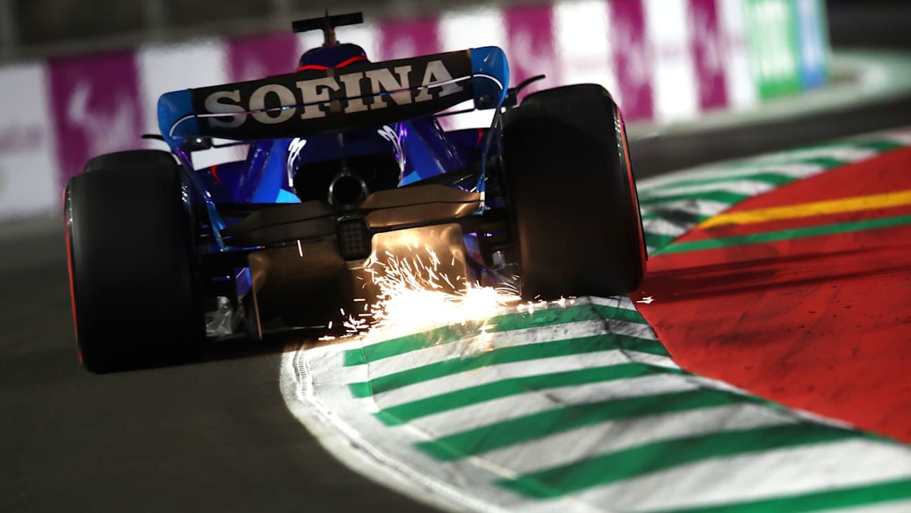 JEDDAH, SAUDI ARABIA - MARCH 26: Sparks fly behind Alexander Albon of Thailand driving the (23) Williams FW44 Mercedes on track during qualifying ahead of the F1 Grand Prix of Saudi Arabia at the Jeddah Corniche Circuit on March 26, 2022 in Jeddah, Saudi Arabia. (Photo by Joe Portlock - Formula 1/Formula 1 via Getty Images)