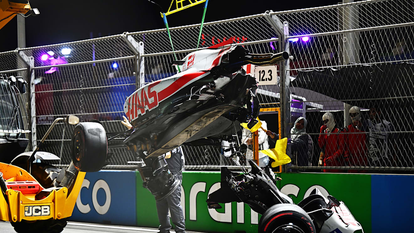 JEDDAH, SAUDI ARABIA - MARCH 26: Track marshals clean debris from the track following the crash of Mick Schumacher of Germany and Haas F1 during qualifying ahead of the F1 Grand Prix of Saudi Arabia at the Jeddah Corniche Circuit on March 26, 2022 in Jeddah, Saudi Arabia. (Photo by Clive Mason/Getty Images)