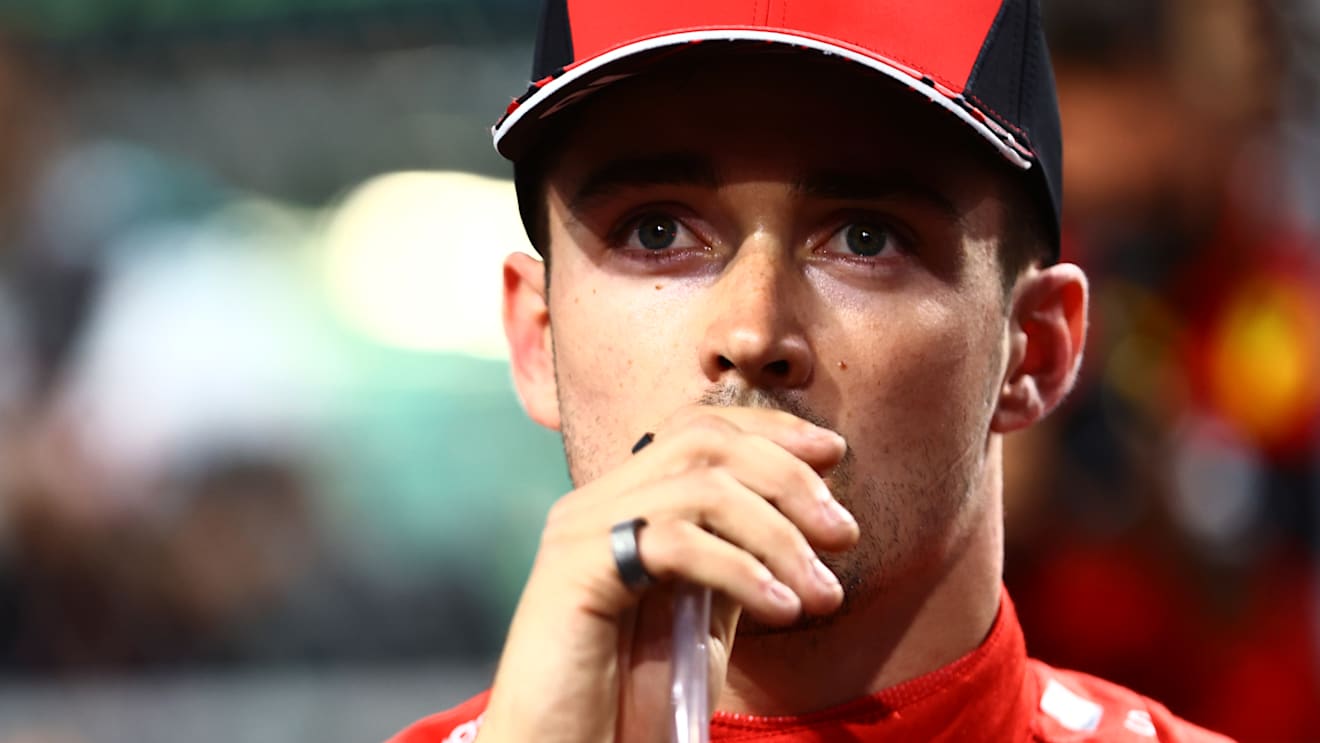 JEDDAH, SAUDI ARABIA - MARCH 26: Second placed qualifier Charles Leclerc of Monaco and Ferrari takes a drink in parc ferme during qualifying ahead of the F1 Grand Prix of Saudi Arabia at the Jeddah Corniche Circuit on March 26, 2022 in Jeddah, Saudi Arabia. (Photo by Mark Thompson/Getty Images)