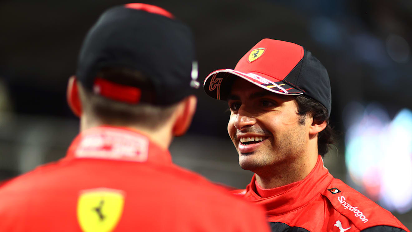 JEDDAH, SAUDI ARABIA - MARCH 26: Third placed qualifier Carlos Sainz of Spain and Ferrari talks with Second placed qualifier Charles Leclerc of Monaco and Ferrari in parc ferme during qualifying ahead of the F1 Grand Prix of Saudi Arabia at the Jeddah Corniche Circuit on March 26, 2022 in Jeddah, Saudi Arabia. (Photo by Dan Istitene - Formula 1/Formula 1 via Getty Images)