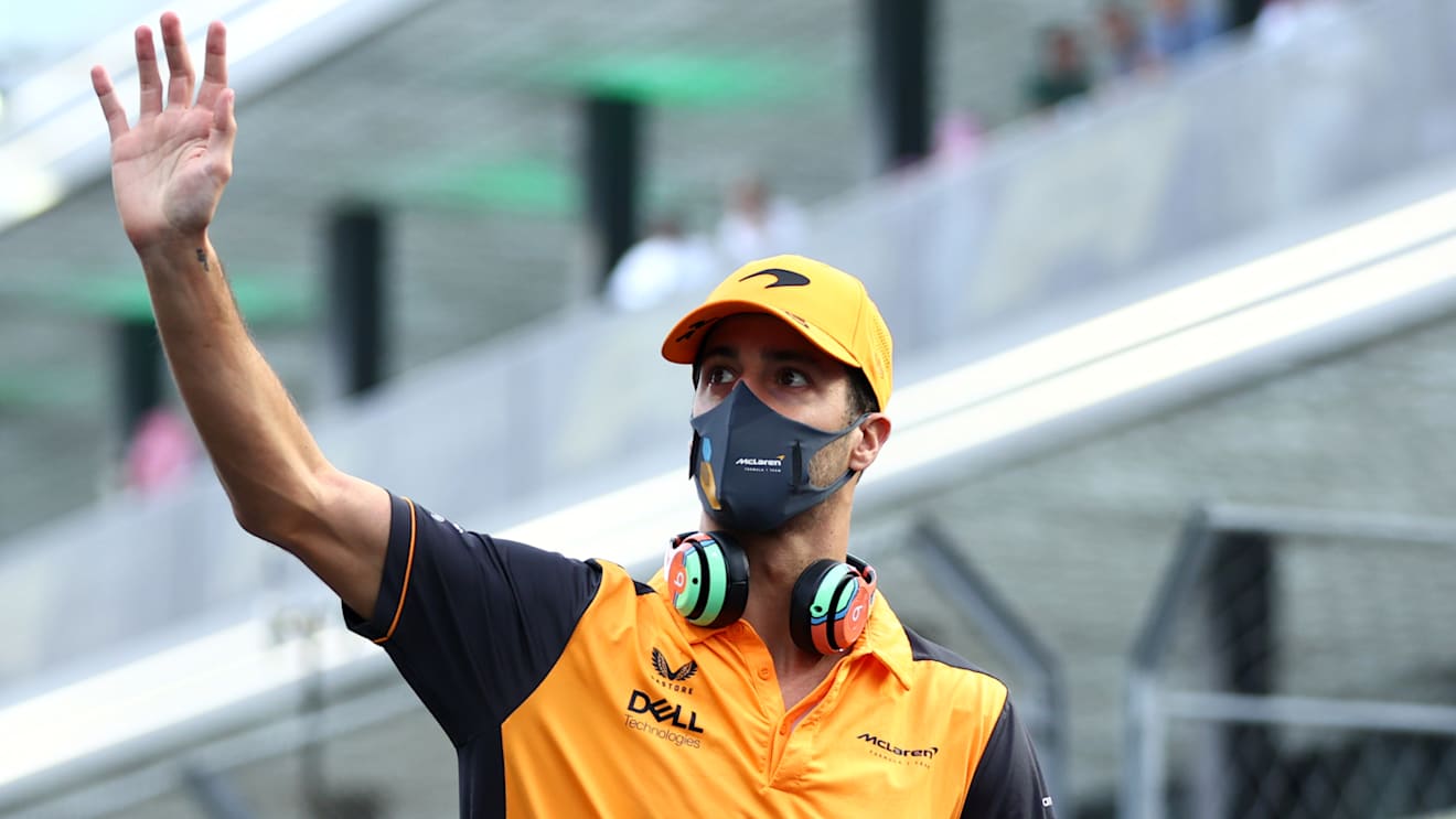 JEDDAH, SAUDI ARABIA - MARCH 27: Daniel Ricciardo of Australia and McLaren waves to the crowd on the drivers parade ahead of the F1 Grand Prix of Saudi Arabia at the Jeddah Corniche Circuit on March 27, 2022 in Jeddah, Saudi Arabia. (Photo by Lars Baron/Getty Images)