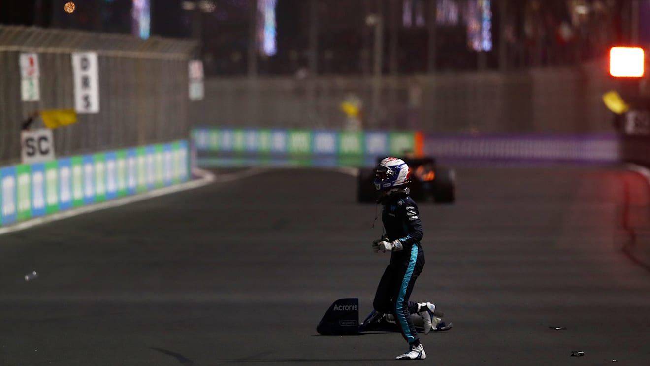 JEDDAH, SAUDI ARABIA - MARCH 27: Nicholas Latifi of Canada and Williams runs across the track after crashing during the F1 Grand Prix of Saudi Arabia at the Jeddah Corniche Circuit on March 27, 2022 in Jeddah, Saudi Arabia. (Photo by Joe Portlock - Formula 1/Formula 1 via Getty Images)