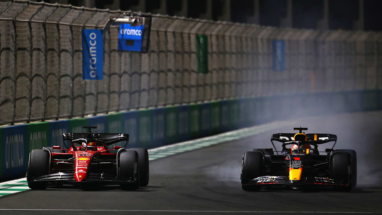 JEDDAH, SAUDI ARABIA - MARCH 27: Max Verstappen of the Netherlands driving the (1) Oracle Red Bull Racing RB18 and Charles Leclerc of Monaco driving (16) the Ferrari F1-75 battle for track position during the F1 Grand Prix of Saudi Arabia at the Jeddah Corniche Circuit on March 27, 2022 in Jeddah, Saudi Arabia. (Photo by Joe Portlock - Formula 1/Formula 1 via Getty Images)