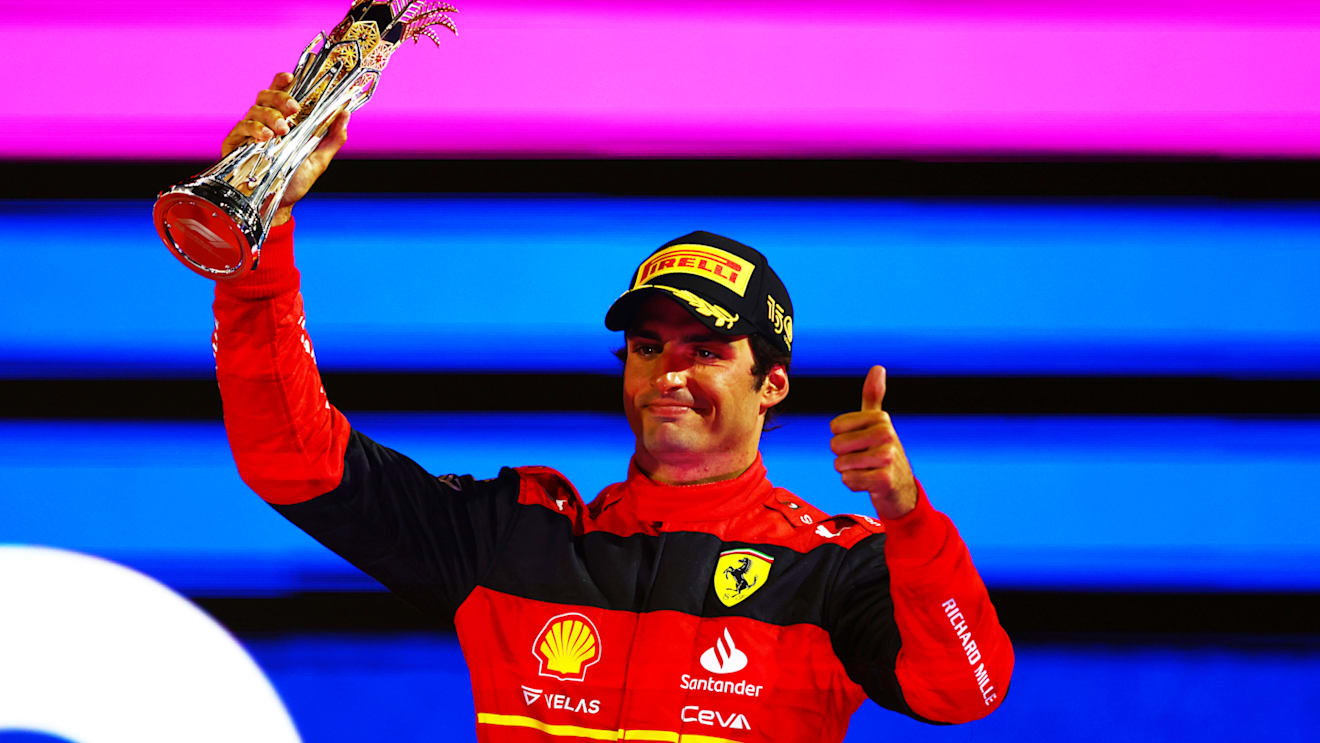 JEDDAH, SAUDI ARABIA - MARCH 27: Third placed Carlos Sainz of Spain and Ferrari celebrates on the podium during the F1 Grand Prix of Saudi Arabia at the Jeddah Corniche Circuit on March 27, 2022 in Jeddah, Saudi Arabia. (Photo by Mark Thompson/Getty Images)