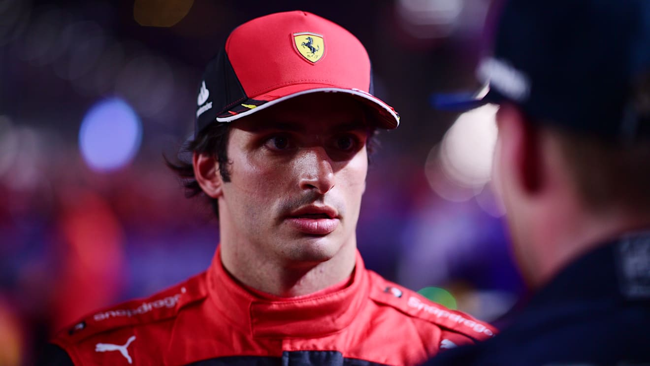 JEDDAH, SAUDI ARABIA - MARCH 27: Third placed Carlos Sainz of Spain and Ferrari talks with Race winner Max Verstappen of the Netherlands and Oracle Red Bull Racing in parc ferme during the F1 Grand Prix of Saudi Arabia at the Jeddah Corniche Circuit on March 27, 2022 in Jeddah, Saudi Arabia. (Photo by Mario Renzi - Formula 1/Formula 1 via Getty Images)