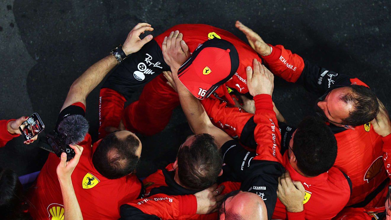 JEDDAH, SAUDI ARABIA - MARCH 27: Second placed Charles Leclerc of Monaco and Ferrari celebrates with his team in parc ferme during the F1 Grand Prix of Saudi Arabia at the Jeddah Corniche Circuit on March 27, 2022 in Jeddah, Saudi Arabia. (Photo by Clive Rose - Formula 1/Formula 1 via Getty Images)