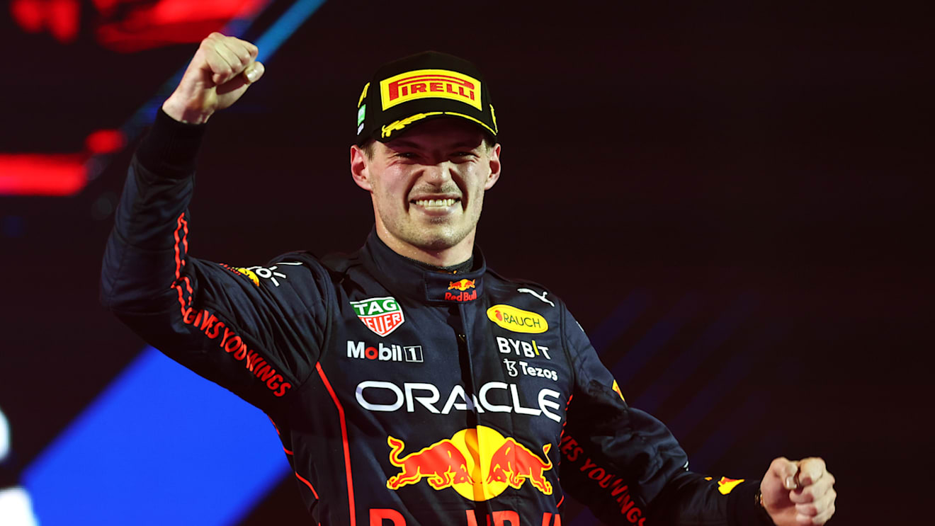 JEDDAH, SAUDI ARABIA - MARCH 27: Race winner Max Verstappen of the Netherlands and Oracle Red Bull Racing celebrates on the podium during the F1 Grand Prix of Saudi Arabia at the Jeddah Corniche Circuit on March 27, 2022 in Jeddah, Saudi Arabia. (Photo by Lars Baron/Getty Images)