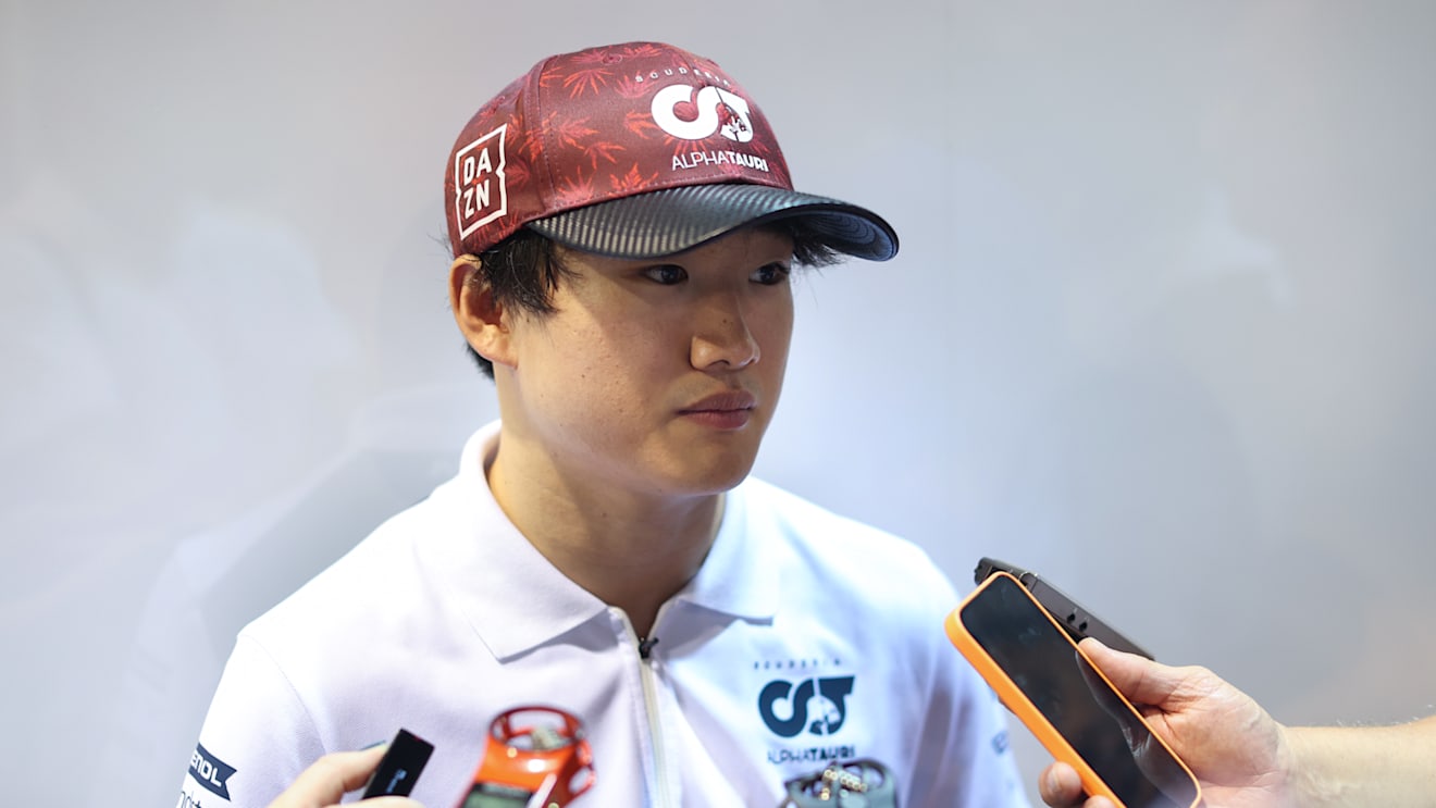 SINGAPORE, SINGAPORE - SEPTEMBER 30: Yuki Tsunoda of Japan and Scuderia AlphaTauri talks to the media in the Paddock after practice ahead of the F1 Grand Prix of Singapore at Marina Bay Street Circuit on September 30, 2022 in Singapore, Singapore. (Photo by Peter Fox/Getty Images,)