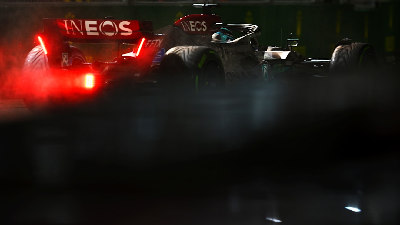 SINGAPORE, SINGAPORE - OCTOBER 02: George Russell of Great Britain driving the (63) Mercedes AMG Petronas F1 Team W13 on his way to the grid prior to the F1 Grand Prix of Singapore at Marina Bay Street Circuit on October 02, 2022 in Singapore, Singapore. (Photo by Clive Mason/Getty Images,)