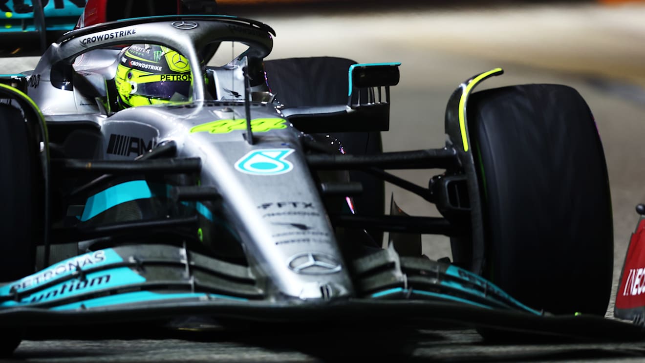 SINGAPORE, SINGAPORE - OCTOBER 02: Lewis Hamilton of Great Britain driving the (44) Mercedes AMG Petronas F1 Team W13 with a broken front wing during the F1 Grand Prix of Singapore at Marina Bay Street Circuit on October 02, 2022 in Singapore, Singapore. (Photo by Mark Thompson/Getty Images,)