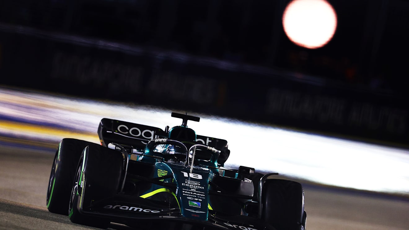 SINGAPORE, SINGAPORE - OCTOBER 02: Lance Stroll of Canada driving the (18) Aston Martin AMR22 Mercedes on track during the F1 Grand Prix of Singapore at Marina Bay Street Circuit on October 02, 2022 in Singapore, Singapore. (Photo by Clive Rose/Getty Images,)