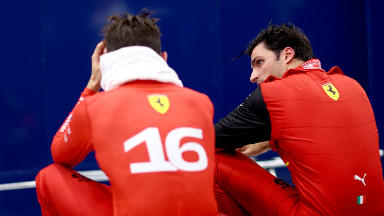 SINGAPORE, SINGAPORE - OCTOBER 02: Third placed Carlos Sainz of Spain and Ferrari and Second placed Charles Leclerc of Monaco and Ferrari talk in parc ferme during the F1 Grand Prix of Singapore at Marina Bay Street Circuit on October 02, 2022 in Singapore, Singapore. (Photo by Dan Istitene - Formula 1/Formula 1 via Getty Images)