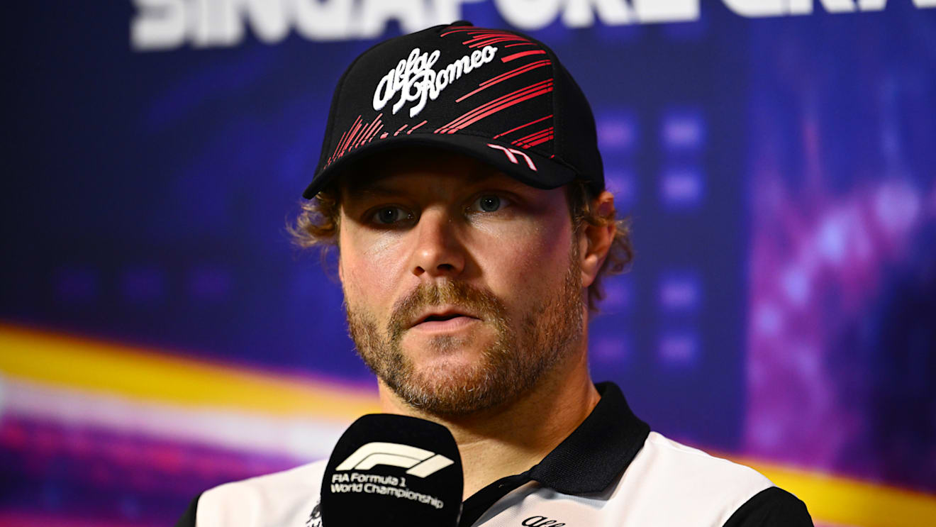 SINGAPORE, SINGAPORE - SEPTEMBER 29: Valtteri Bottas of Finland and Alfa Romeo F1 attends the Drivers Press Conference during previews ahead of the F1 Grand Prix of Singapore at Marina Bay Street Circuit on September 29, 2022 in Singapore, Singapore. (Photo by Clive Mason/Getty Images,)