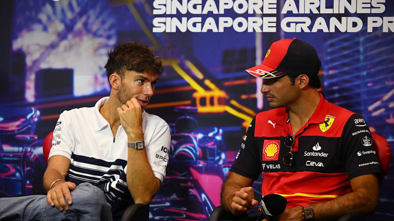 SINGAPORE, SINGAPORE - SEPTEMBER 29: Pierre Gasly of France and Scuderia AlphaTauri and Carlos Sainz of Spain and Ferrari talk in the Drivers Press Conference during previews ahead of the F1 Grand Prix of Singapore at Marina Bay Street Circuit on September 29, 2022 in Singapore, Singapore. (Photo by Clive Mason/Getty Images,)