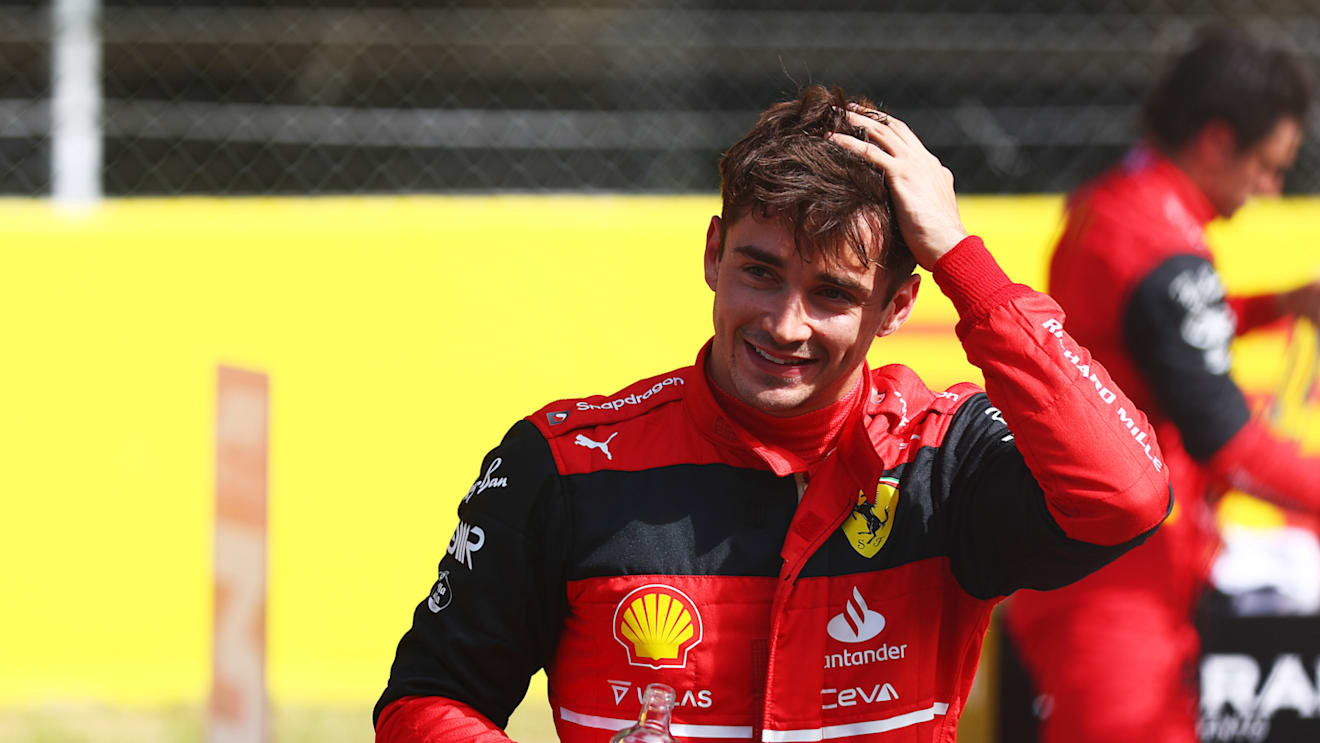 BARCELONA, SPAIN - MAY 21: Pole position qualifier Charles Leclerc of Monaco and Ferrari smiles in parc ferme during qualifying ahead of the F1 Grand Prix of Spain at Circuit de Barcelona-Catalunya on May 21, 2022 in Barcelona, Spain. (Photo by Mark Thompson/Getty Images)