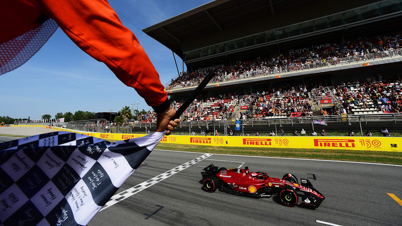 BARCELONA, SPAIN - MAY 21: Pole position qualifier Charles Leclerc of Monaco driving the (16) Ferrari F1-75 takes the chequered flag during qualifying ahead of the F1 Grand Prix of Spain at Circuit de Barcelona-Catalunya on May 21, 2022 in Barcelona, Spain. (Photo by Mario Renzi - Formula 1/Formula 1 via Getty Images)