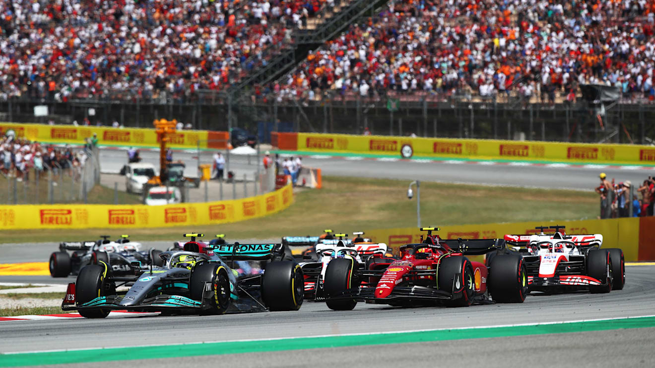 BARCELONA, SPAIN - MAY 22: Lewis Hamilton of Great Britain driving the (44) Mercedes AMG Petronas F1 Team W13 leads Carlos Sainz of Spain driving (55) the Ferrari F1-75 during the F1 Grand Prix of Spain at Circuit de Barcelona-Catalunya on May 22, 2022 in Barcelona, Spain. (Photo by Joe Portlock - Formula 1/Formula 1 via Getty Images)