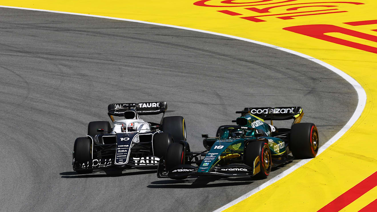 BARCELONA, SPAIN - MAY 22: Pierre Gasly of France driving the (10) Scuderia AlphaTauri AT03 and Lance Stroll of Canada driving the (18) Aston Martin AMR22 Mercedes battle for track position during the F1 Grand Prix of Spain at Circuit de Barcelona-Catalunya on May 22, 2022 in Barcelona, Spain. (Photo by Lars Baron/Getty Images)