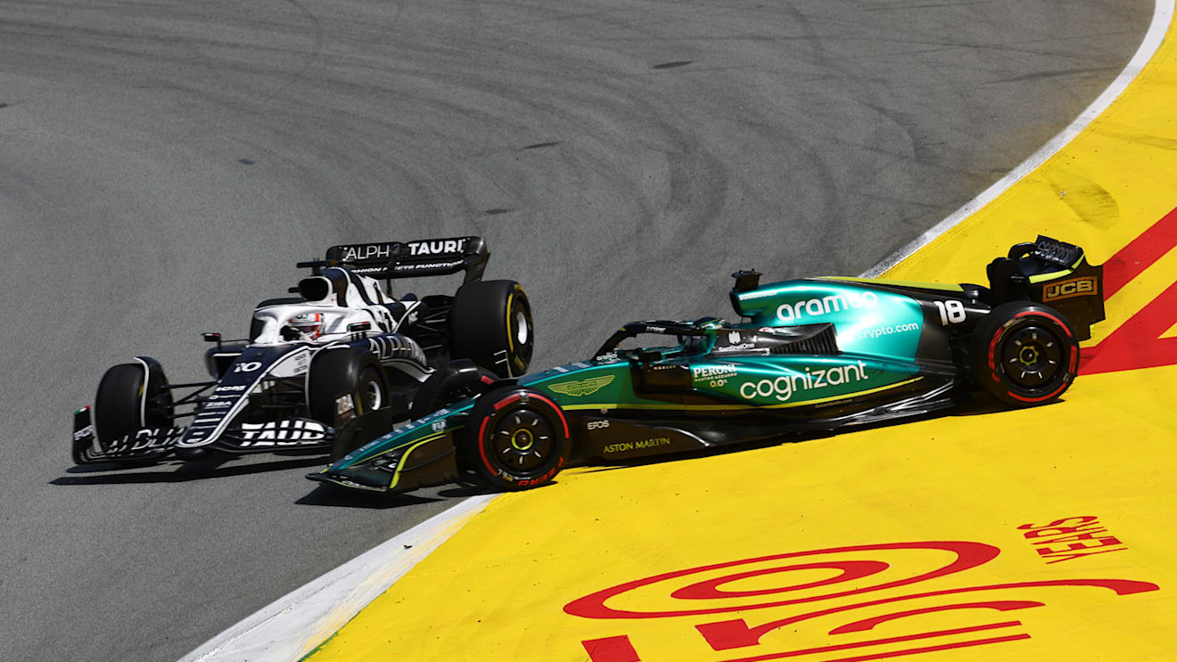 BARCELONA, SPAIN - MAY 22: Pierre Gasly of France driving the (10) Scuderia AlphaTauri AT03 and Lance Stroll of Canada driving the (18) Aston Martin AMR22 Mercedes battle for track position during the F1 Grand Prix of Spain at Circuit de Barcelona-Catalunya on May 22, 2022 in Barcelona, Spain. (Photo by Lars Baron/Getty Images)