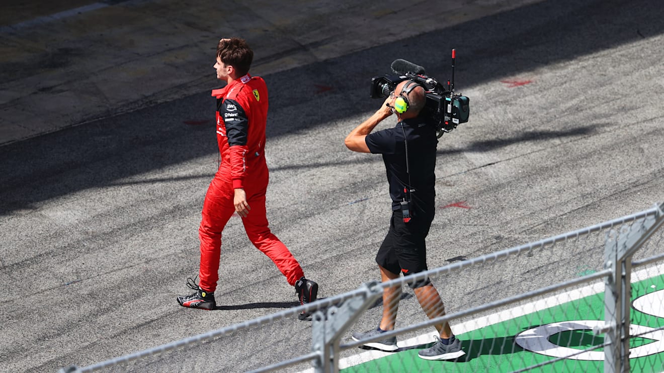 BARCELONA, SPAIN - MAY 22: Charles Leclerc of Monaco and Ferrari walks in the Pitlane after retiring from the race during the F1 Grand Prix of Spain at Circuit de Barcelona-Catalunya on May 22, 2022 in Barcelona, Spain. (Photo by Dan Istitene - Formula 1/Formula 1 via Getty Images)