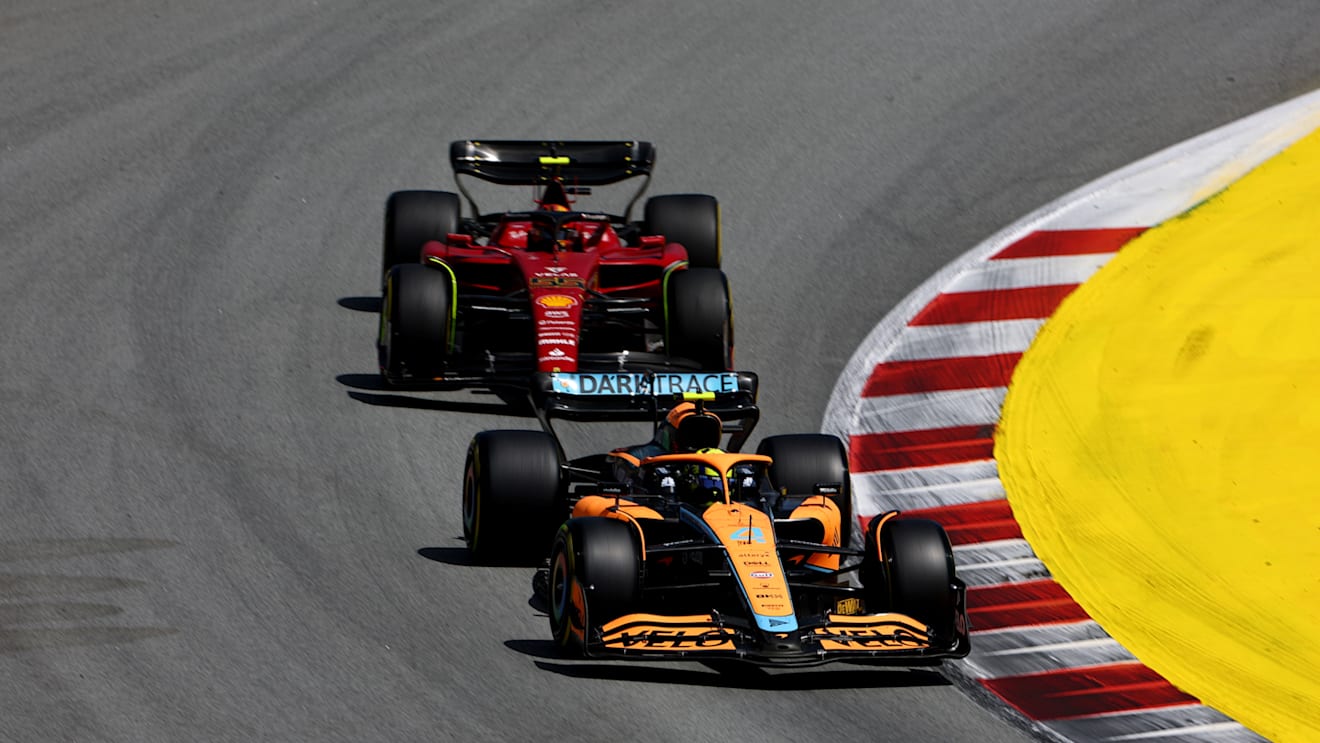 BARCELONA, SPAIN - MAY 22: Lando Norris of Great Britain driving the (4) McLaren MCL36 Mercedes leads Carlos Sainz of Spain driving (55) the Ferrari F1-75 during the F1 Grand Prix of Spain at Circuit de Barcelona-Catalunya on May 22, 2022 in Barcelona, Spain. (Photo by Lars Baron/Getty Images)
