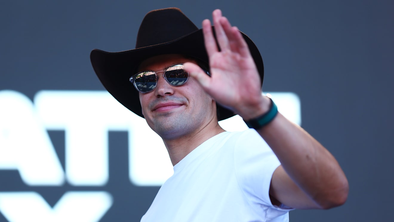 AUSTIN, TEXAS - OCTOBER 21: Lance Stroll of Canada and Aston Martin F1 Team greets the crowd on the fan stage prior to practice ahead of the F1 Grand Prix of USA at Circuit of The Americas on October 21, 2022 in Austin, Texas. (Photo by Dan Istitene - Formula 1/Formula 1 via Getty Images)