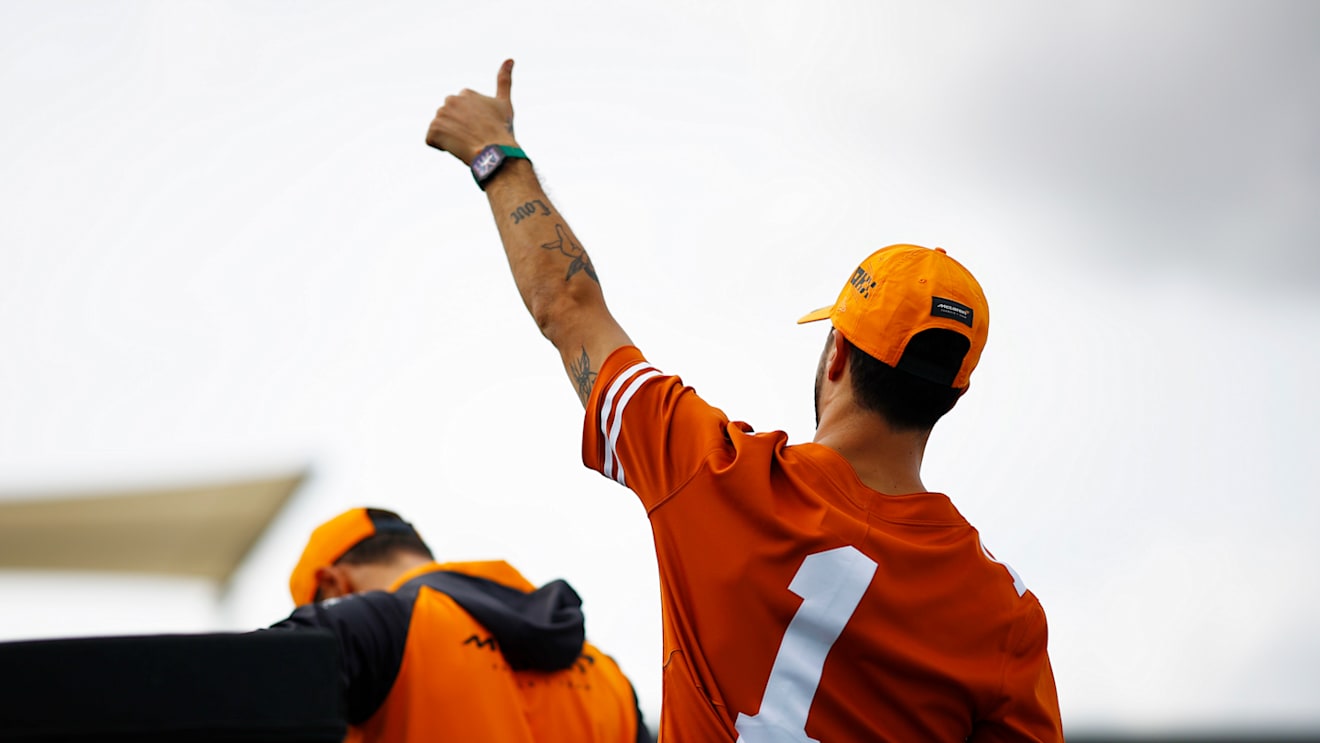 AUSTIN, TEXAS - OCTOBER 23: Daniel Ricciardo of Australia and McLaren waves to the crowd on the drivers parade prior to the F1 Grand Prix of USA at Circuit of The Americas on October 23, 2022 in Austin, Texas. (Photo by Chris Graythen/Getty Images)