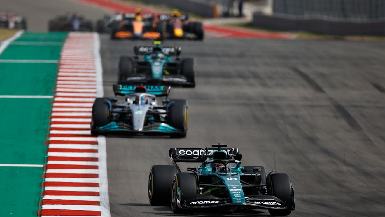 AUSTIN, TEXAS - OCTOBER 23: Lance Stroll of Canada driving the (18) Aston Martin AMR22 Mercedes leads George Russell of Great Britain driving the (63) Mercedes AMG Petronas F1 Team W13 on track during the F1 Grand Prix of USA at Circuit of The Americas on October 23, 2022 in Austin, Texas. (Photo by Jared C. Tilton/Getty Images)