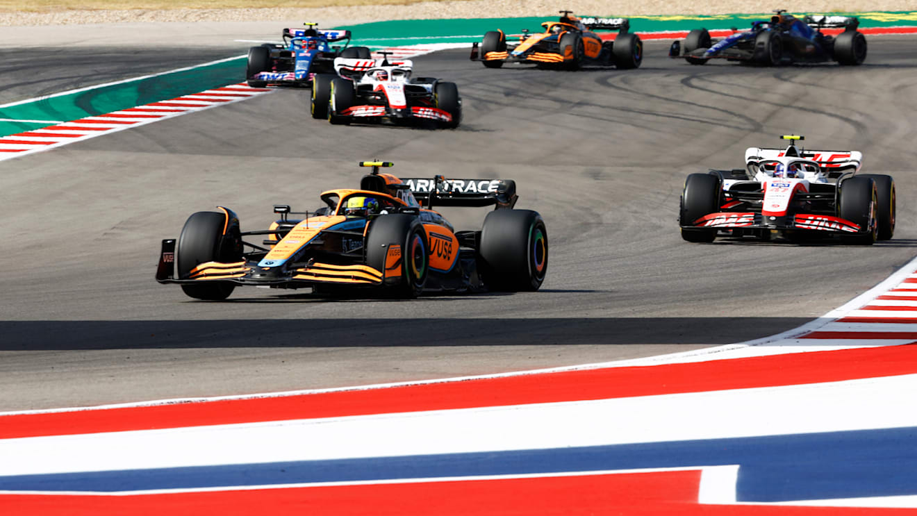 AUSTIN, TEXAS - OCTOBER 23: Lando Norris of Great Britain driving the (4) McLaren MCL36 Mercedes leads Mick Schumacher of Germany driving the (47) Haas F1 VF-22 Ferrari on track during the F1 Grand Prix of USA at Circuit of The Americas on October 23, 2022 in Austin, Texas. (Photo by Chris Graythen/Getty Images)