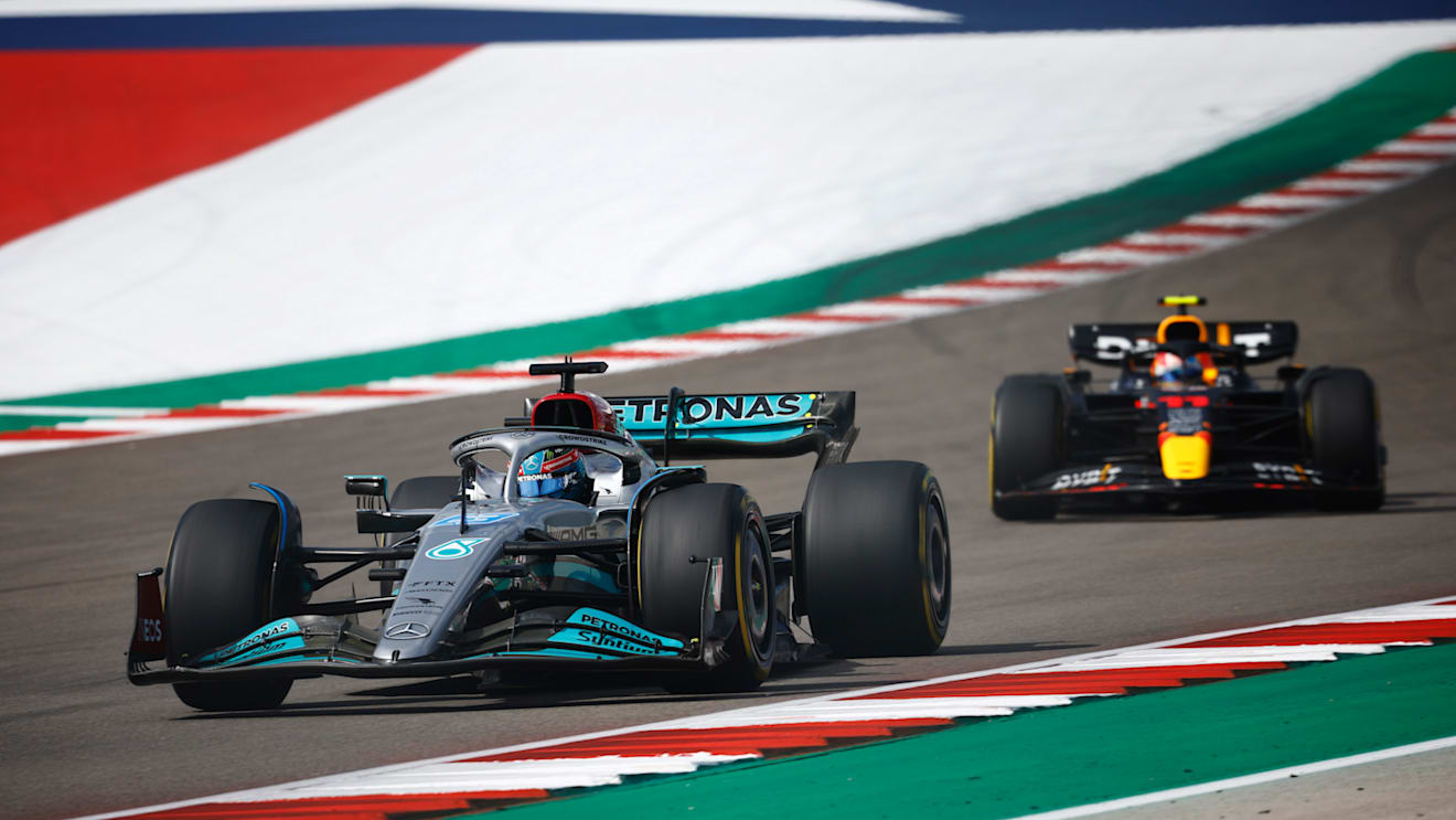 AUSTIN, TEXAS - OCTOBER 23: George Russell of Great Britain driving the (63) Mercedes AMG Petronas F1 Team W13 leads Sergio Perez of Mexico driving the (11) Oracle Red Bull Racing RB18 on trackduring the F1 Grand Prix of USA at Circuit of The Americas on October 23, 2022 in Austin, Texas. (Photo by Chris Graythen/Getty Images)