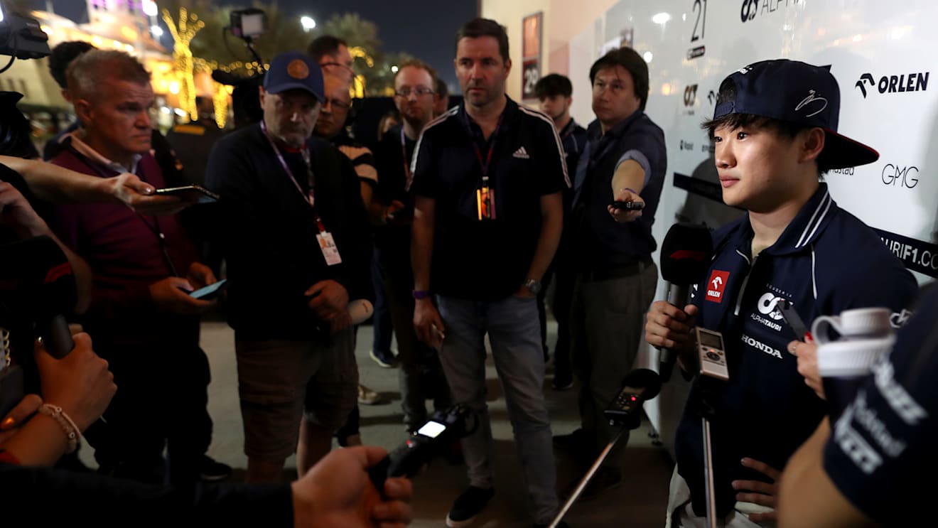 BAHRAIN, BAHRAIN - MARCH 03: Yuki Tsunoda of Japan and Scuderia AlphaTauri talks to the media in the Paddock after practice ahead of the F1 Grand Prix of Bahrain at Bahrain International Circuit on March 03, 2023 in Bahrain, Bahrain. (Photo by Peter Fox/Getty Images)