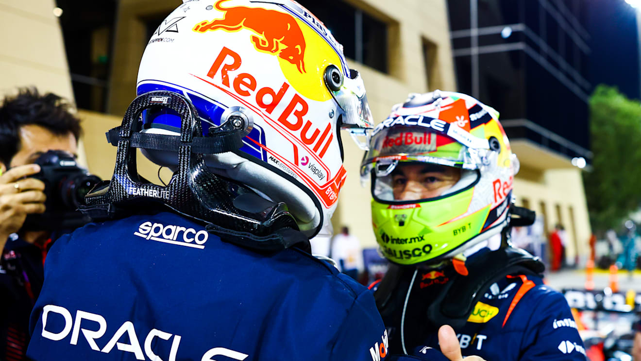 BAHRAIN, BAHRAIN - MARCH 04: Pole position qualifier Max Verstappen of the Netherlands and Oracle Red Bull Racing and Second placed qualifier Sergio Perez of Mexico and Oracle Red Bull Racing talk in parc ferme during qualifying ahead of the F1 Grand Prix of Bahrain at Bahrain International Circuit on March 04, 2023 in Bahrain, Bahrain. (Photo by Mark Thompson/Getty Images)