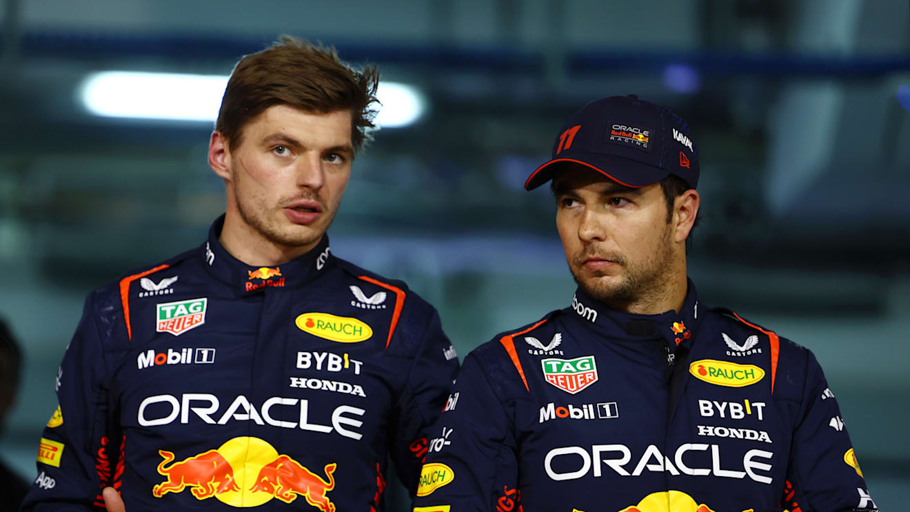 BAHRAIN, BAHRAIN - MARCH 04: Pole position qualifier Max Verstappen of the Netherlands and Oracle Red Bull Racing and Second placed qualifier Sergio Perez of Mexico and Oracle Red Bull Racing talk in parc ferme during qualifying ahead of the F1 Grand Prix of Bahrain at Bahrain International Circuit on March 04, 2023 in Bahrain, Bahrain. (Photo by Mark Thompson/Getty Images)