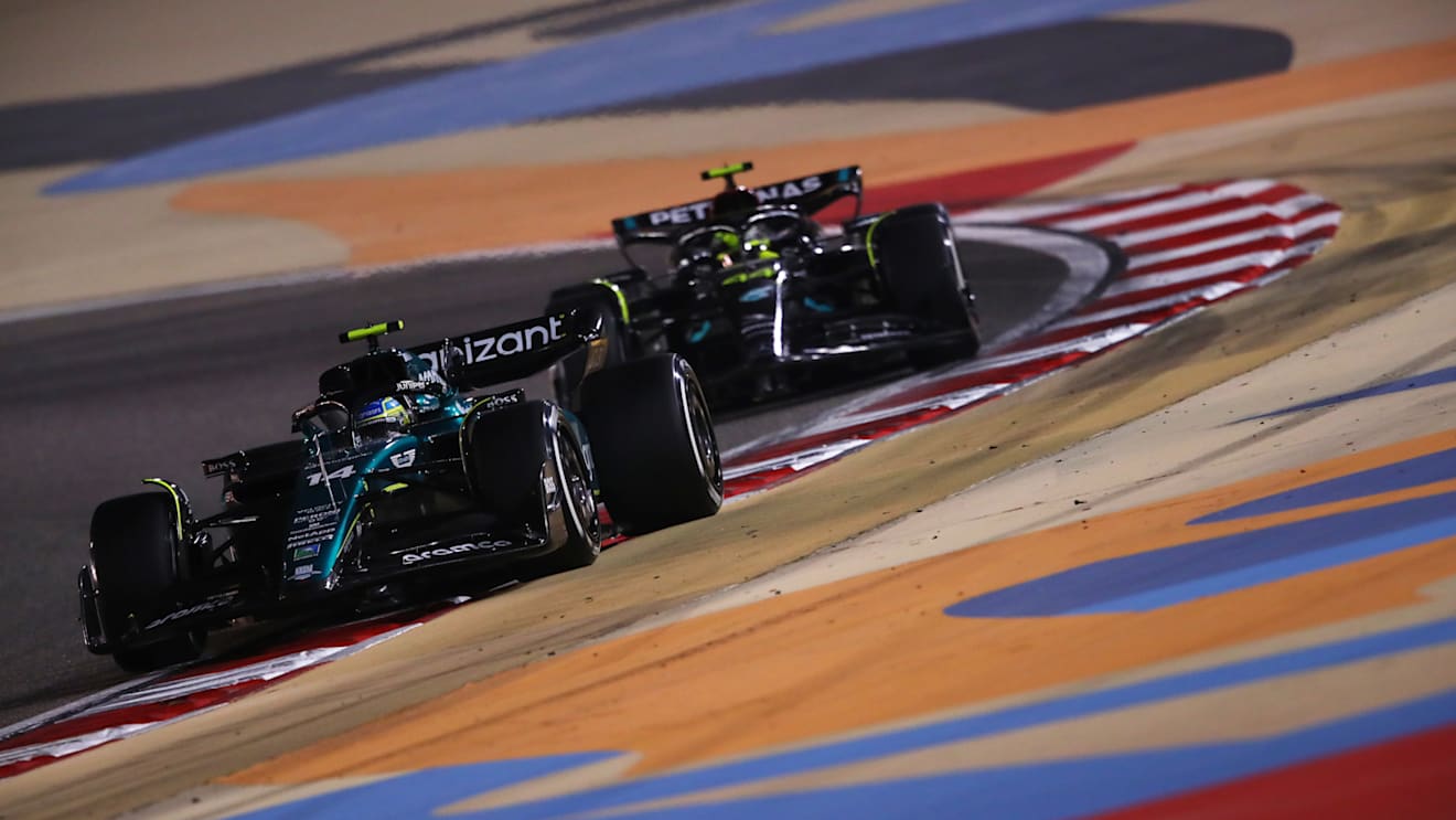 BAHRAIN, BAHRAIN - MARCH 05: Fernando Alonso of Spain driving the (14) Aston Martin AMR23 Mercedes leads Lewis Hamilton of Great Britain driving the (44) Mercedes AMG Petronas F1 Team W14 during the F1 Grand Prix of Bahrain at Bahrain International Circuit on March 05, 2023 in Bahrain, Bahrain. (Photo by Joe Portlock - Formula 1/Formula 1 via Getty Images)