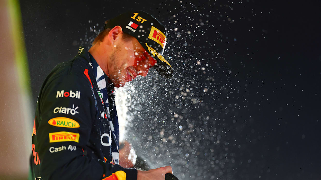 BAHRAIN, BAHRAIN - MARCH 05: Race winner Max Verstappen of the Netherlands and Oracle Red Bull Racing celebrates on the podium during the F1 Grand Prix of Bahrain at Bahrain International Circuit on March 05, 2023 in Bahrain, Bahrain. (Photo by Dan Istitene - Formula 1/Formula 1 via Getty Images)