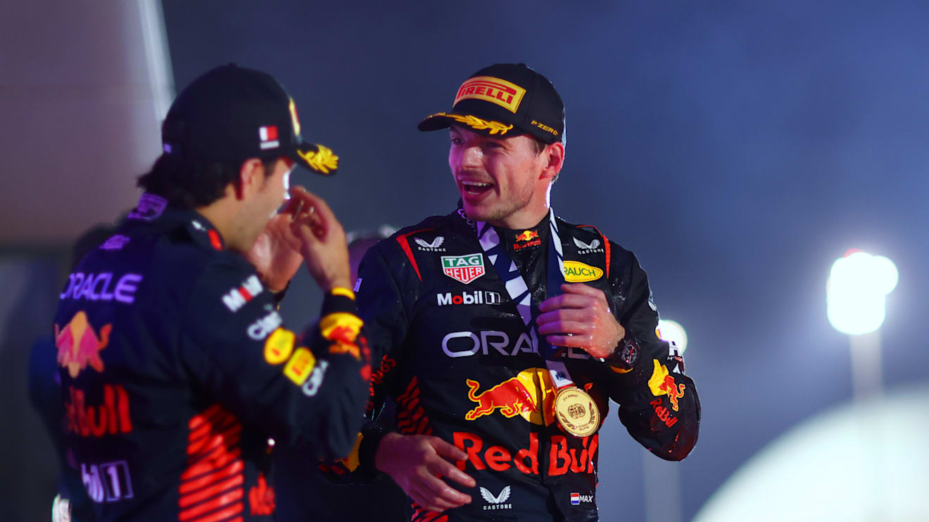 BAHRAIN, BAHRAIN - MARCH 05: Race winner Max Verstappen of the Netherlands and Oracle Red Bull Racing celebrates with team-mate Second placed Sergio Perez of Mexico and Oracle Red Bull Racing on the podium during the F1 Grand Prix of Bahrain at Bahrain International Circuit on March 05, 2023 in Bahrain, Bahrain. (Photo by Dan Istitene - Formula 1/Formula 1 via Getty Images)